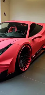 Red sports car in a garage with sleek design.