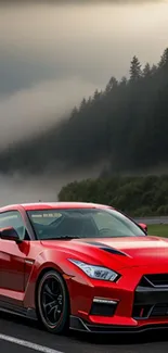 Red sports car parked on misty mountain road.