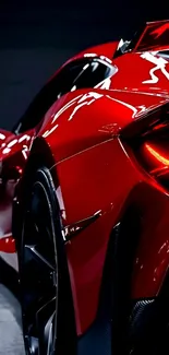 Close-up of a sleek red sports car in profile view.