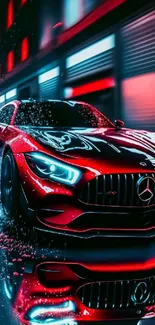 Sleek red sports car under neon lights.