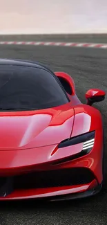 A sleek red sports car on a racing track