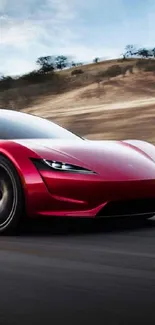 Sleek red sports car speeding down a highway.