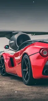 Stunning red supercar with airplane background, exuding speed and elegance.