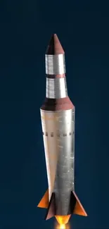 Metallic rocket against a deep blue space background.