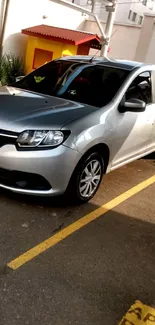 Sleek silver sedan parked in an urban setting, showcasing modern design and style.