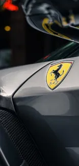 Sleek silver Ferrari side view with logo on door.