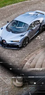 Sleek silver supercar parked elegantly on cobblestone.