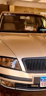 Front view of beige Skoda car in a garage setting.