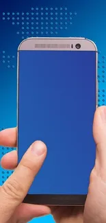 Hands holding a smartphone with blue screen on digital background.