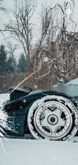 A sleek black car in a snowy winter landscape.