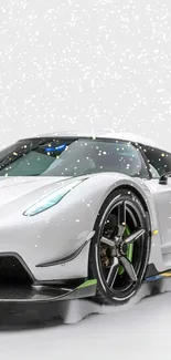 Sleek white sports car in snowy background wallpaper.