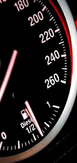 Sleek speedometer with red accents on a dark dashboard background.