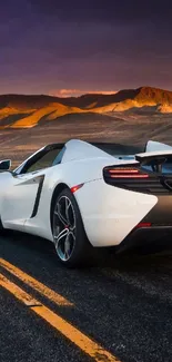 White sports car on road during sunset by mountains.