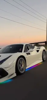 Sleek sports car driving on highway at sunset with colorful underglow.