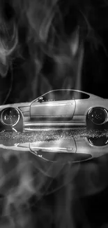 Monochrome sports car with smoke and reflection background.