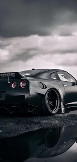 A sleek sports car with reflective surface against a cloudy sky backdrop.