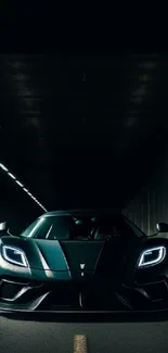 Sleek sports car speeding through a dimly lit urban tunnel.