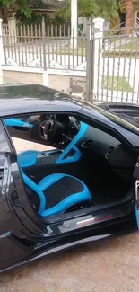 Black sports car with blue interior details.