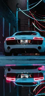 Sleek sports car in neon-lit urban street at night.