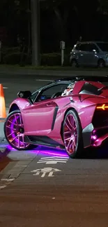 Vibrant sports car with neon lights at night on a city street.