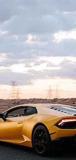 Yellow sports car driving on a highway with a scenic sunset view.