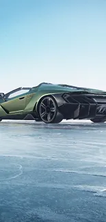 Green sports car on ice with blue sky.