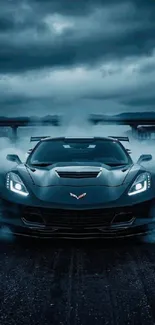 Sleek sports car driving through smoke on a dark road.