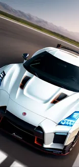 Sleek white sports car racing on track with dynamic design.