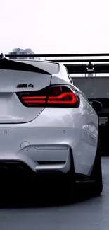 Rear view of a sleek, modern sports car in an urban setting.