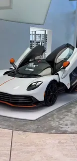White sports car with sleek design and open doors.