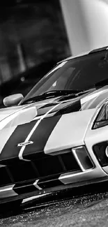 High-contrast black and white sports car parked stylishly.