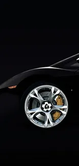 Sleek black sports car with a focus on the wheel, perfect for mobile wallpaper.