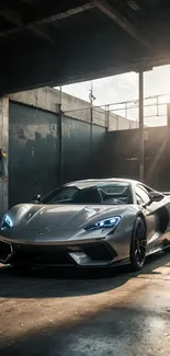 Luxury sports car in an industrial setting with sunlight.