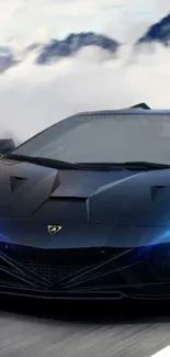 Sleek black sports car on a mountain road.