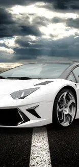 Dynamic sports car on open road under dramatic sky.