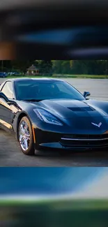 Black Corvette parked stylishly in evening light.