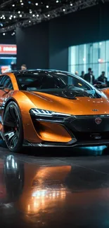 Sleek orange sports car at an automotive show.