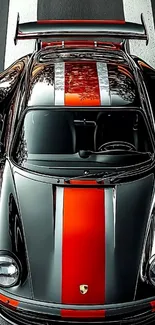 Top view of sleek sports car with red stripes.