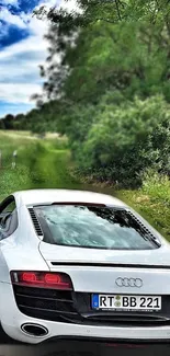 White sports car on scenic road with green nature backdrop.