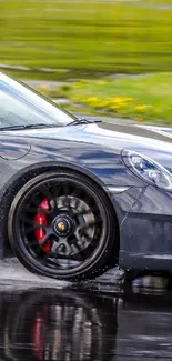 Sleek sports car driving swiftly on wet track.