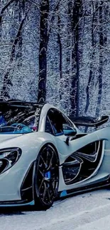 Sleek white supercar parked in a snowy winter forest.