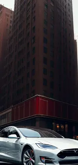 White car in urban street scene with towering buildings.