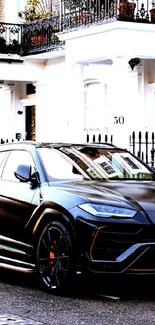 Luxury black SUV parked on an urban street.