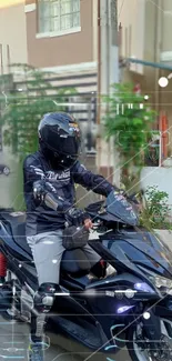 Sleek black motorcycle with rider in an urban setting.