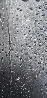 Mobile wallpaper featuring water droplets on a sleek, dark gray background.