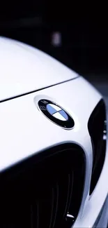 Close-up of a sleek BMW front view, highlighting luxury design.