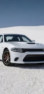 White sports car on a snowy winter landscape.