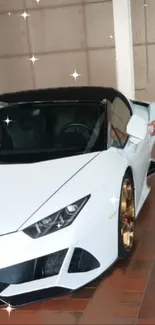 Sleek white sports car with gold rims parked indoors.