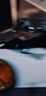 Blurry shot of white sports car with golden rims.