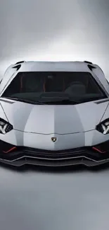 Front view of a sleek white sports car.